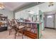 Open kitchen with counter seating, white appliances, and ample cabinet space at 127 Tidewater Dr # 127, Bradenton, FL 34210