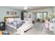 Spacious main bedroom with a king bed, ceiling fan, and a desk area at 127 Tidewater Dr # 127, Bradenton, FL 34210