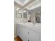 Bathroom vanity features double sinks, modern fixtures, and a large mirror at 128 Nancy Dr # 128, Oldsmar, FL 34677