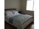 Inviting bedroom with wood floors, a comfortable bed, and ample natural light at 128 Nancy Dr # 128, Oldsmar, FL 34677