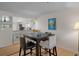 Bright dining area adjacent to the kitchen, featuring a modern table set at 128 Nancy Dr # 128, Oldsmar, FL 34677