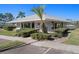 Exterior view of the amenity center showcasing the manicured lawn and landscaping at 128 Nancy Dr # 128, Oldsmar, FL 34677