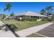 Exterior view of the amenity center showcasing the manicured lawn and landscaping at 128 Nancy Dr # 128, Oldsmar, FL 34677