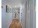 Long hallway leads to the living area with convenient storage space at 128 Nancy Dr # 128, Oldsmar, FL 34677