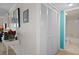 Hallway with closet space that leads to the bathroom at 128 Nancy Dr # 128, Oldsmar, FL 34677
