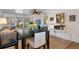 Bright living space with an adjacent dining area and access to a screened patio at 128 Nancy Dr # 128, Oldsmar, FL 34677