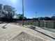 Well-maintained tennis courts surrounded by lush landscaping, perfect for an active lifestyle at 128 Nancy Dr # 128, Oldsmar, FL 34677