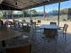 Outdoor dining area overlooking the beautiful tennis courts, perfect for relaxing after a match at 128 Nancy Dr # 128, Oldsmar, FL 34677