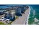 Breathtaking aerial view of beachfront high-rise condos along the coastline with stunning ocean views at 1480 Gulf Blvd # 410, Clearwater Beach, FL 33767