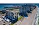Beautiful aerial view of beachfront condos with lush green spaces and sparkling ocean views at 1480 Gulf Blvd # 410, Clearwater Beach, FL 33767
