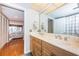 Bathroom with double vanity, neutral tones, and convenient linen closet at 1480 Gulf Blvd # 410, Clearwater Beach, FL 33767