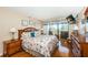 Comfortable bedroom with balcony access and stylish decor at 1480 Gulf Blvd # 410, Clearwater Beach, FL 33767