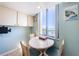 Cozy breakfast nook with ocean view and ample natural light at 1480 Gulf Blvd # 410, Clearwater Beach, FL 33767