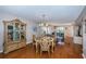 Inviting dining area with glass table, chandelier, and built-in cabinet at 1480 Gulf Blvd # 410, Clearwater Beach, FL 33767