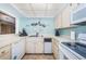 Efficient kitchen with white appliances and ample counter space at 1480 Gulf Blvd # 410, Clearwater Beach, FL 33767