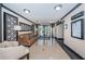 Elegant lobby featuring comfortable seating, decorative panels, and tile flooring at 1480 Gulf Blvd # 410, Clearwater Beach, FL 33767