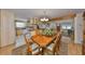 Open concept kitchen, dining, and living areas with wood beam and hardwood floors at 1520 S Richard Ave, Tampa, FL 33629