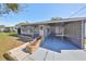Inviting home featuring a carport, stylish brick accents, and a neat front lawn at 1520 S Richard Ave, Tampa, FL 33629