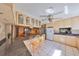 Open floor plan with a kitchen island, chairs, cabinets, and appliances at 1520 S Richard Ave, Tampa, FL 33629