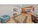 Bright living area with hardwood floors, a decorative rug, and an open floor plan at 1520 S Richard Ave, Tampa, FL 33629