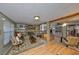 Finished basement area with fireplace, comfortable seating, built-in shelving, and wood-look flooring at 1520 S Richard Ave, Tampa, FL 33629