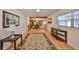 Bright living area with hardwood floors, a decorative rug, and an open floor plan at 1520 S Richard Ave, Tampa, FL 33629