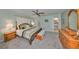 Spacious main bedroom with a ceiling fan, a king bed, and a dresser at 1520 S Richard Ave, Tampa, FL 33629