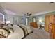 Main bedroom featuring a ceiling fan, a king bed, and a dresser at 1520 S Richard Ave, Tampa, FL 33629