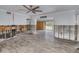 Partially renovated room showcasing wood-look floors, exposed concrete block and wood framing, and a ceiling fan at 1817 Santa Barbara Dr, Dunedin, FL 34698