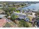 Aerial view of waterfront property with backyard, lush greenery, and neighborhood scenery at 19 Sandpiper Rd, Tampa, FL 33609