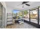 Enclosed sunroom with brick flooring, and an abundance of natural light, ideal for relaxation and hobbies at 19 Sandpiper Rd, Tampa, FL 33609
