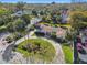 An aerial view of a home with a pool, circular driveway and lush landscaping at 1905 S Hesperides St, Tampa, FL 33629