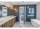 This modern bathroom features a sleek vanity, fireplace, and luxury bathtub at 201 Punta Vista Dr, St Pete Beach, FL 33706