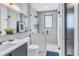 Contemporary bathroom features a glass enclosed shower, modern fixtures, and neutral tile at 201 Punta Vista Dr, St Pete Beach, FL 33706