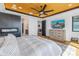 This bedroom features a fireplace, mounted TV, and hardwood floors at 201 Punta Vista Dr, St Pete Beach, FL 33706