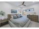 Serene main bedroom with cool color palette and a ceiling fan at 201 Punta Vista Dr, St Pete Beach, FL 33706