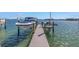 A waterfront dock provides easy boat access with boat lifts and beautiful water views at 201 Punta Vista Dr, St Pete Beach, FL 33706