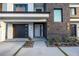 Contemporary home featuring a modern garage door, decorative stone accents and walkway at 201 Punta Vista Dr, St Pete Beach, FL 33706