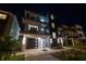 Modern home exterior featuring clean lines, dark accents, and manicured landscaping at 201 Punta Vista Dr, St Pete Beach, FL 33706