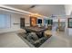 Bright game room featuring a pool table, water views and comfortable seating area at 201 Punta Vista Dr, St Pete Beach, FL 33706