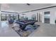 Spacious game room featuring a pool table, bar area, and seamless indoor-outdoor living at 201 Punta Vista Dr, St Pete Beach, FL 33706
