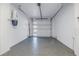 Clean and well-lit garage with epoxy floors, automatic door, and integrated lighting at 201 Punta Vista Dr, St Pete Beach, FL 33706