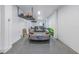 Spacious garage featuring epoxy flooring, overhead storage racks, and ample room for vehicle parking at 201 Punta Vista Dr, St Pete Beach, FL 33706