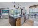 Contemporary kitchen with island open to living and dining areas with water views at 201 Punta Vista Dr, St Pete Beach, FL 33706