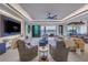 Elegant living room with water views, modern furnishings, and abundant natural light at 201 Punta Vista Dr, St Pete Beach, FL 33706