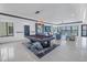 Spacious living room featuring a modern pool table and lots of natural light at 201 Punta Vista Dr, St Pete Beach, FL 33706