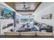 Cozy living room with a fireplace, waterfront views, and comfortable seating for entertaining at 201 Punta Vista Dr, St Pete Beach, FL 33706