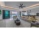 Open floor plan featuring a large sofa, modern furniture, and water views at 201 Punta Vista Dr, St Pete Beach, FL 33706