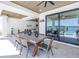 Alfresco dining area with waterfront views and outdoor kitchen at 201 Punta Vista Dr, St Pete Beach, FL 33706