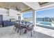 Waterfront patio with built in grill, dining area, and relaxing pool at 201 Punta Vista Dr, St Pete Beach, FL 33706